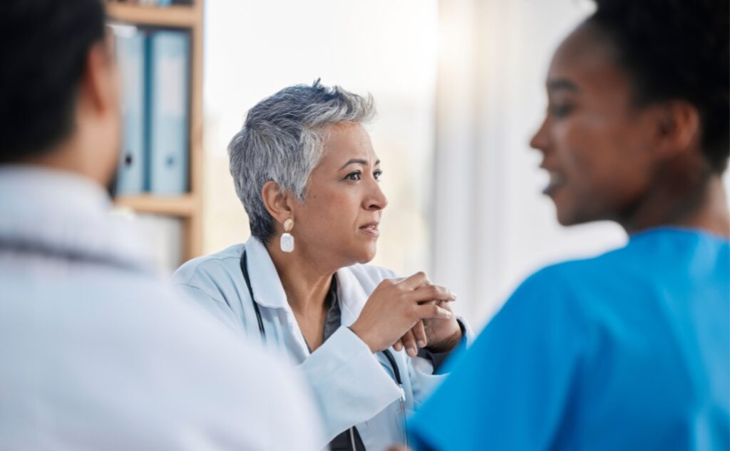 Healthcare workers having a discussion at a meeting